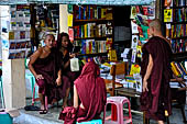 Yangon Myanmar. Monks on the covered walkway to Shwedagon Pagoda.